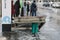 The fallen roof of a glass bus stop and people near the road with cars - Moscow, Russia, 03 04 2021