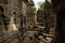 Fallen stone blocks littering ruined temple courtyard