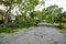 Fallen trees damaged power lines, sidewalk and car in the aftermath of severe weather as tropical storm Isaias hits New York City