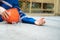 fallen worker on floor with his helmet, accident injury