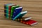 Falling books on table. 3D illustration