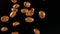 Falling coffee beans on the black background