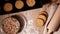 Falling cornflakes. Fresh baked cookies on baking tray. Dough roll and scattered flour.