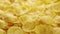 Falling cornflakes in slow motion. Macro. Rotation. Dry corn flake