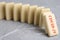 Falling domino tiles on grey marble table, closeup. Spreading of coronavirus concept