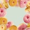 Falling or flying pink glazed doughnuts with sprinkles in motion at pastel blue background