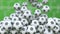 Falling football balls against green field background. 3D rendering