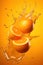 A falling oranges splashing with orange juice on orange background