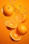 A falling oranges splashing with orange juice on orange background