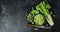 The falling pieces of celery on a plate.