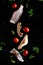 Falling pieces of fresh bacon, cherry tomatoes, parsley and onions on a black background, freeze in motion, for design, cooking