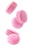 Falling pink macaroons isolated in the air