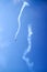 Falling plane on blue sky  background high in the sky, falls down, figure aerobatics The Barrel roll