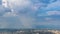Falling Rain And Rainbow Over City Of Chiangmai, Thailand Time Lapse (zoom out)