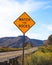 Falling rock sign next to the road