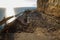 Falling rocks and big collapse hole on closed mountain road under the sea