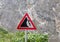 `Falling rocks` road sign