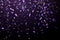 Falling Shiny Glitter purple Confetti isolated on black background. Christmas or Happy New Year Confetti.