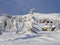 Falling snow and cabins