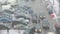 Falling snowflakes and defocused city road with cars. March in Saint-Petersburg city, Russia