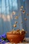 Falling sugar cornflakes in a ceramic bowl close-up top view. light breakfast scattered on the table with blue flowers close-up