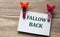 FALLOW BACK - word on a white sheet with beautiful clothespins on a wooden background