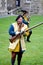 Falmouth, Cornwall, UK - April 12 2018: Historical military re-enactor dressed in bleu and yellow Tudor clothes with leather
