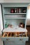 Falmouth, Cornwall, UK - April 12 2018: Self service cutlery, glasses, water and sauces on an antique dresser in a cafe