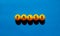 False symbol. Orange table tennis balls with the words `false`. Beautiful blue background, copy space. Warm sunshine. Business,