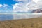 Famara beach at low tide with the islands of archipelago Chinijo in background