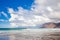 Famara beach at low tide with the islands of archipelago Chinijo in background