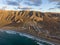 Famara village and Risco de Famara mountains in the background, Spain