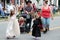 Families dressed up and marching through annual All Things Oz Parade, Chittenango, New York, 2018