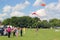 Families flying kites.