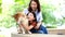 Families with mothers and daughters hugging Shiba Inu dogs and looking at the mouth and teeth for dogs.