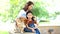 Families with mothers and daughters playing with Shiba Inu dogs in the park in spring