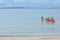 Families paddle in a sea kayak