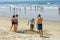 Families playing and building sand castle at the beach