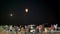 Families sending floating lanterns up into the nights sky