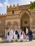 families in traditional dress entering the al-Aqmar Mosque