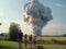 A family of 4 standing in a field watching a large explosion