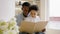 Family African Americans, father and 3-year-old son read book, father teaches his son to read letters. Black skin father