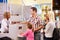 Family At Airport Check In Desk Leaving On Vacation