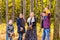 Family, autumn, happiness and people concept - mother, father, son and daughter playing in autumn park