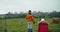 Family in autumn vacation travel expecting pasture of domestic cows on field