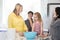 Family baking together in a modern kitchen.