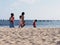 Family on beach and boats on Atlantic Ocean at Sal island, Cape Verde