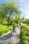 Family on bikes in scenic spring landscape