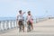 Family on a biking journey on the seaside