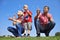 Family blowing soap bubbles